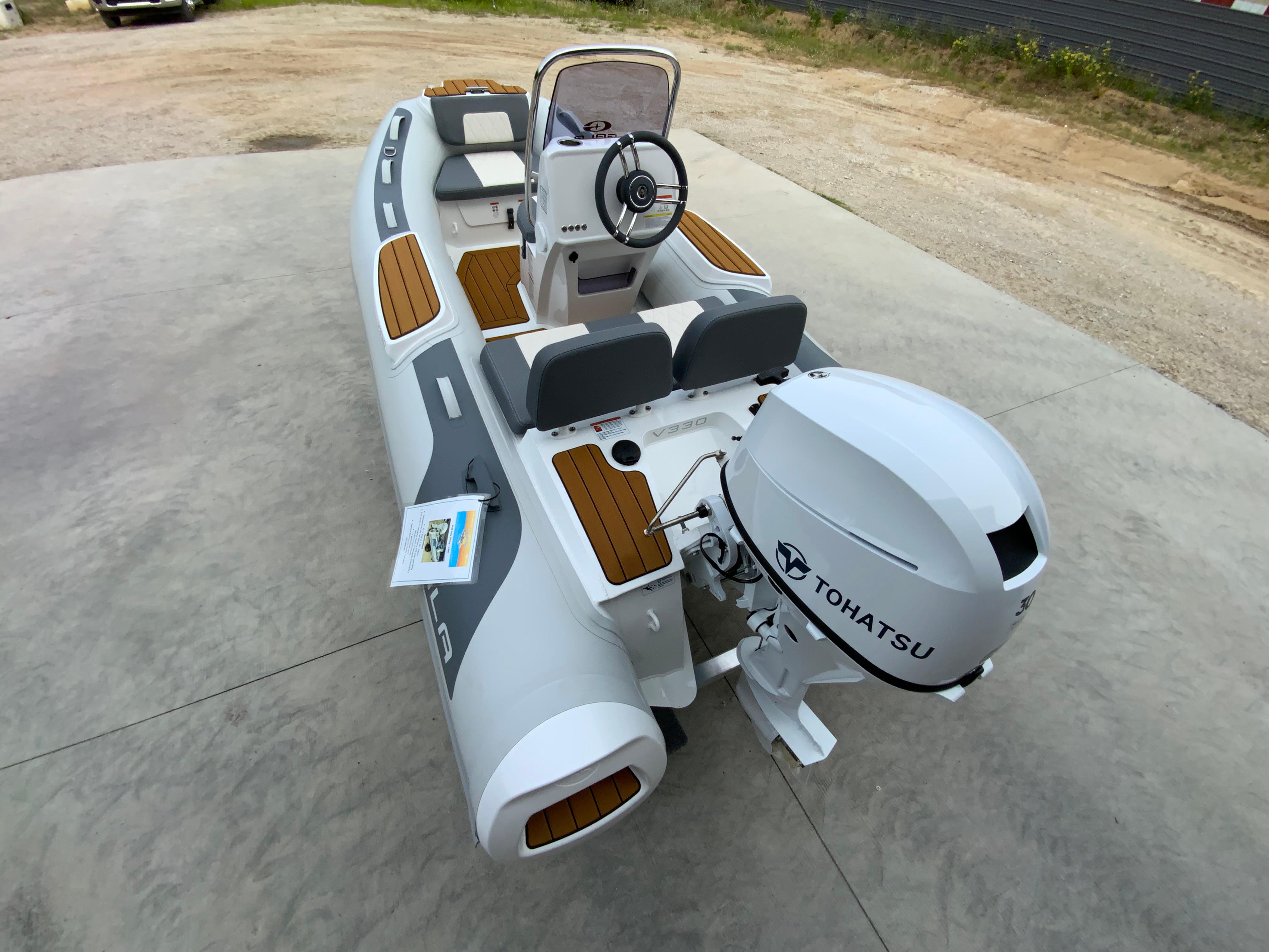 Gala V330 2026 Gala V330 boat with Tohatsu engine, featuring sleek design and wooden accents.