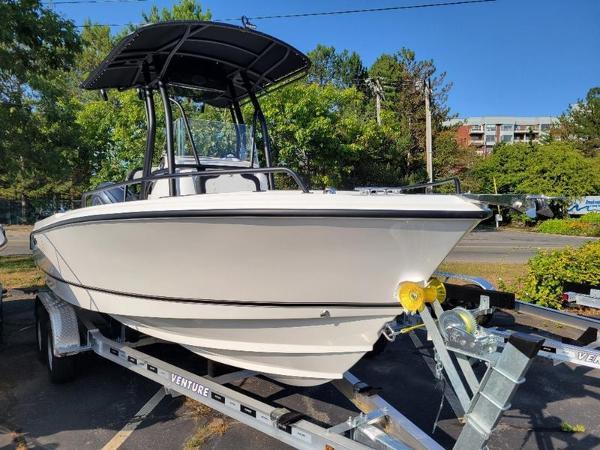 Edgewater 208 WATCHMAN 2025 Edgewater 208 WATCHMAN boat on trailer, parked outdoors.