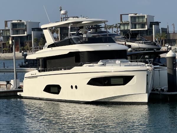 Absolute 52 Navetta 2024 Absolute 52 Navetta yacht docked in a marina, modern design, luxury waterfront living.