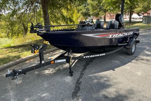 Tracker Super Guide V-16 SC 2026 Tracker Super Guide V-16 SC boat on trailer, parked outdoors.