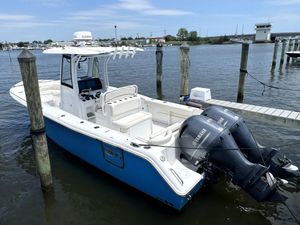 Sea Hunt Ultra 275 SE 2022 Sea Hunt Ultra 275 SE boat docked with twin Yamaha engines.