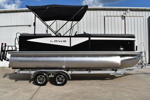 Lowe LS 210 WT 2026 Lowe LS 210 WT pontoon boat on trailer, black and silver design.