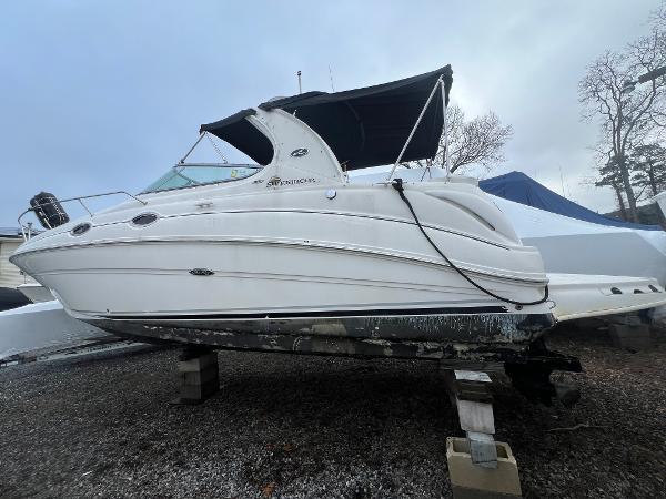 Sea Ray 280 Sundancer 2008 Sea Ray 280 Sundancer boat on dry dock, white hull, black canopy.