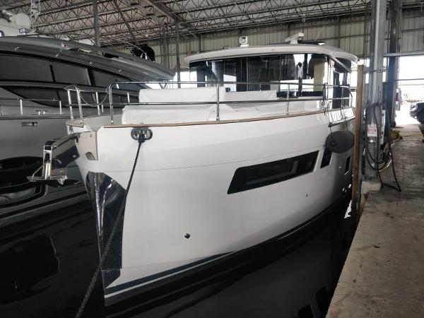 Sirena 48 Coupe 2025 Sirena 48 Coupe yacht docked in a marina.