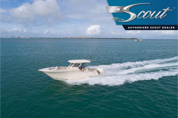 Scout 305 LXF 2025 Scout 305 LXF boat cruising on open water, under clear skies.