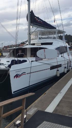 Leopard 58 2015 Leopard 58 catamaran docked at a marina.