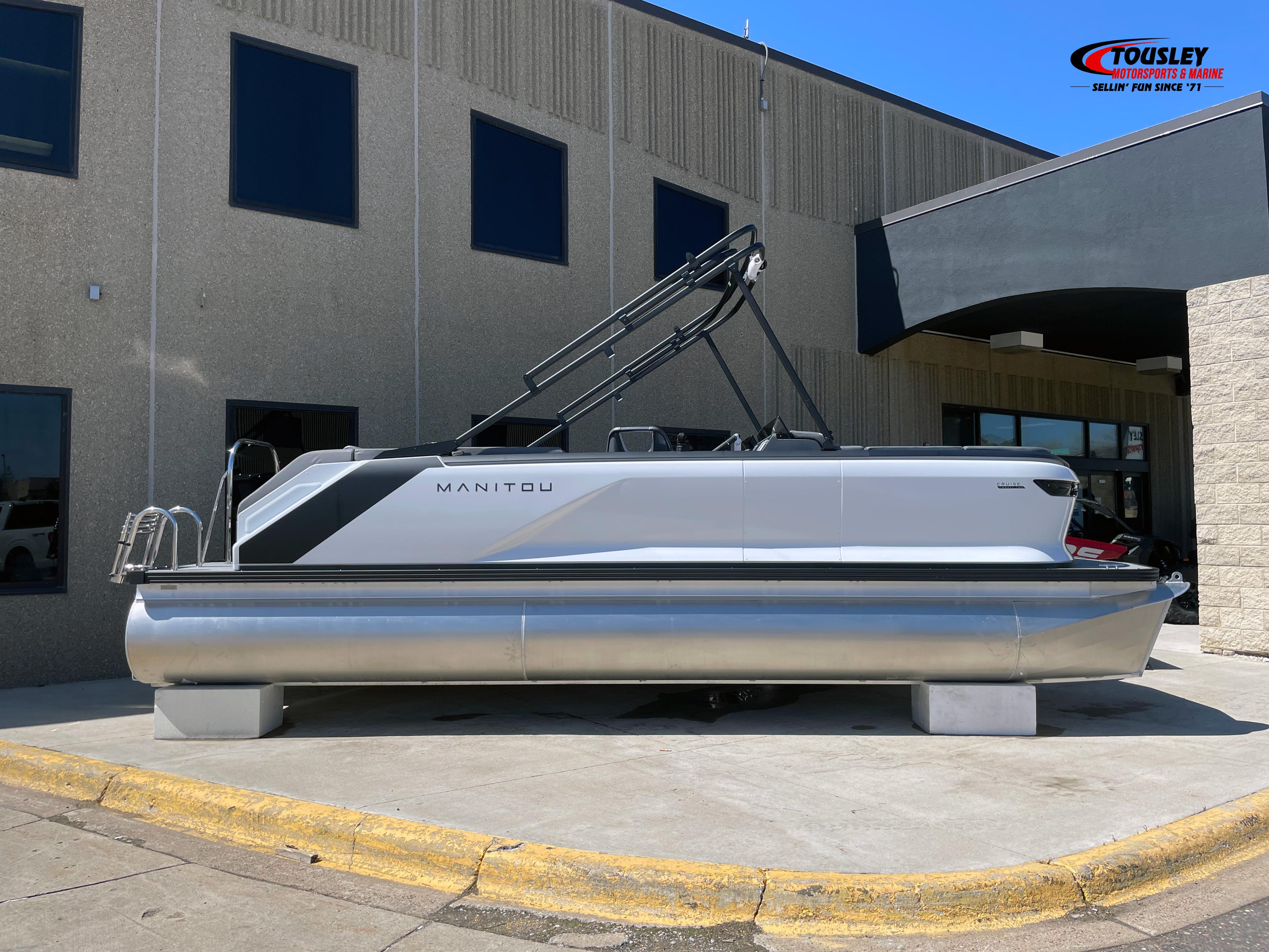 Manitou Cruise 22 Switchback Twin Tube 2025 Manitou Cruise 22 Switchback Twin Tube pontoon boat displayed outside a dealership.