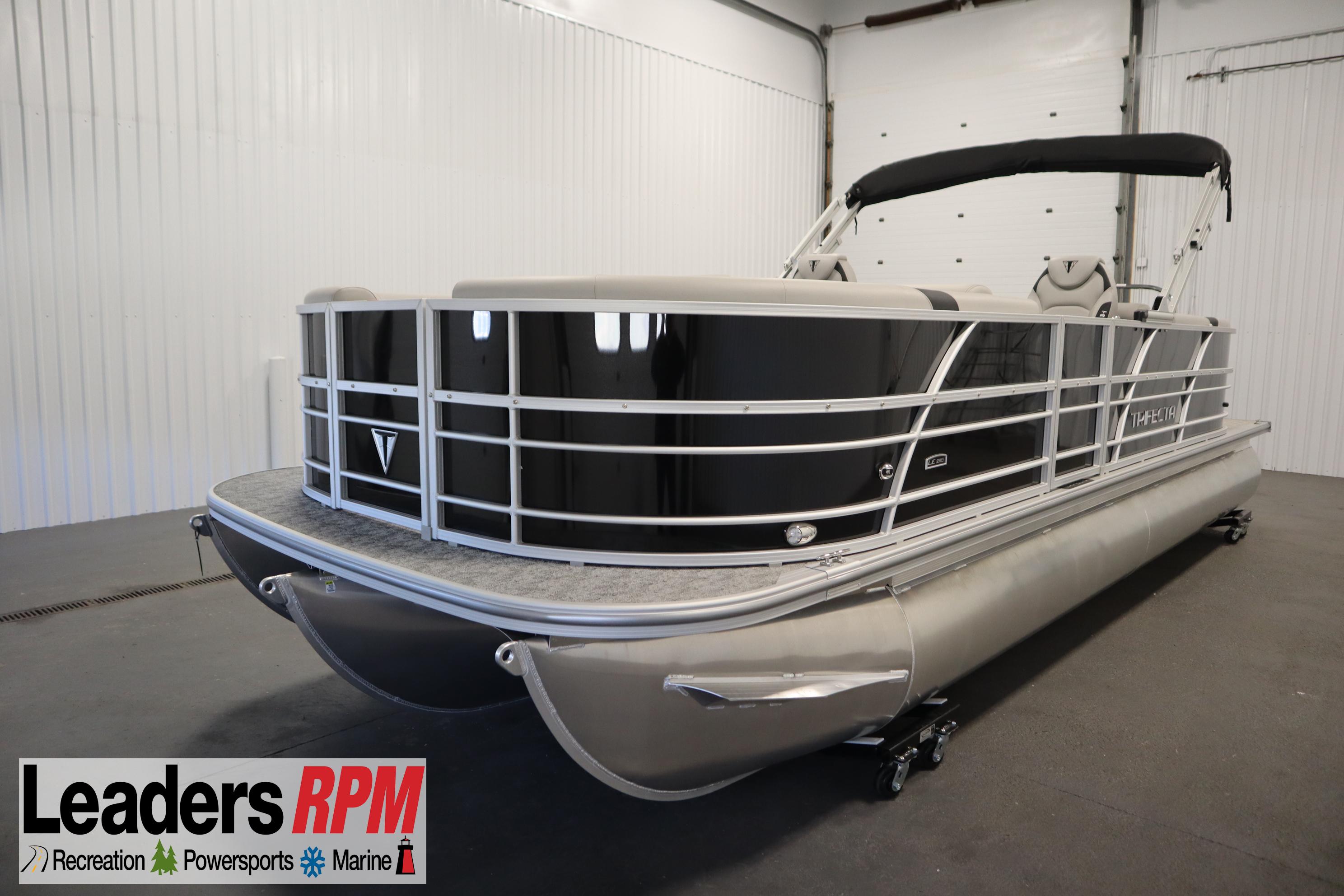 Trifecta 24RF LE 2.75 2025 Trifecta 24RF LE 2.75 pontoon boat in showroom, featuring sleek design and modern amenities.