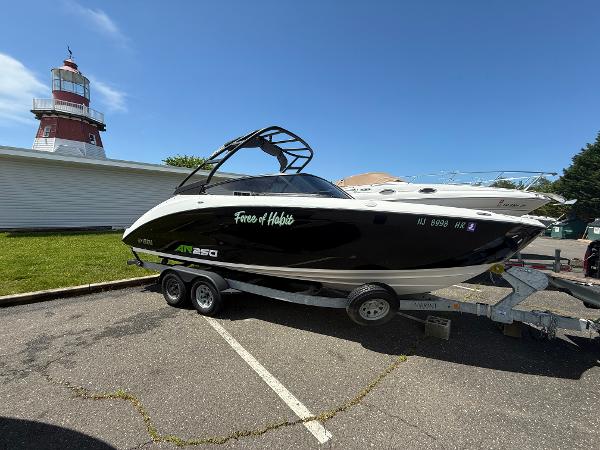 Yamaha Boats AR250 2022 Yamaha AR250 boat on trailer near lighthouse, sunny day.