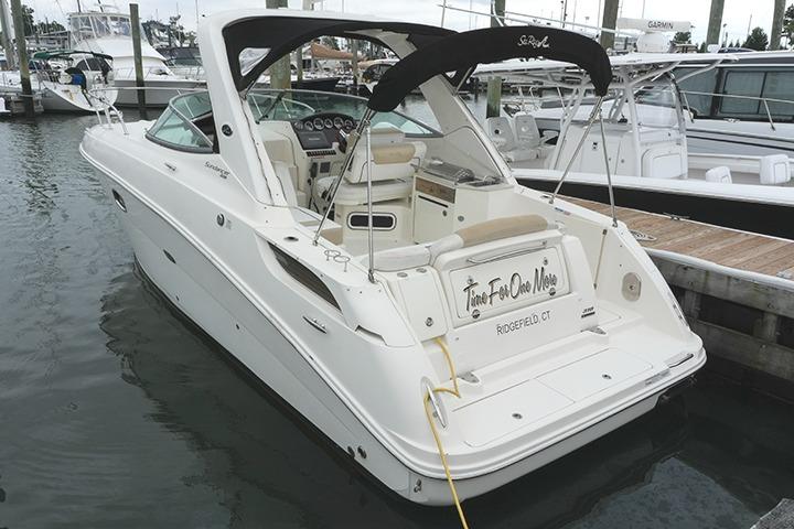 Sea Ray 310 Sundancer 2010 Sea Ray 310 Sundancer boat docked in marina, featuring sleek design and spacious cockpit.