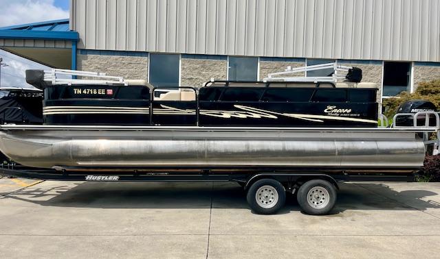 Bentley Pontoons 250/253 Party Cruise 2012 Bentley Pontoons 250/253 Party Cruise on trailer, parked outside industrial building.