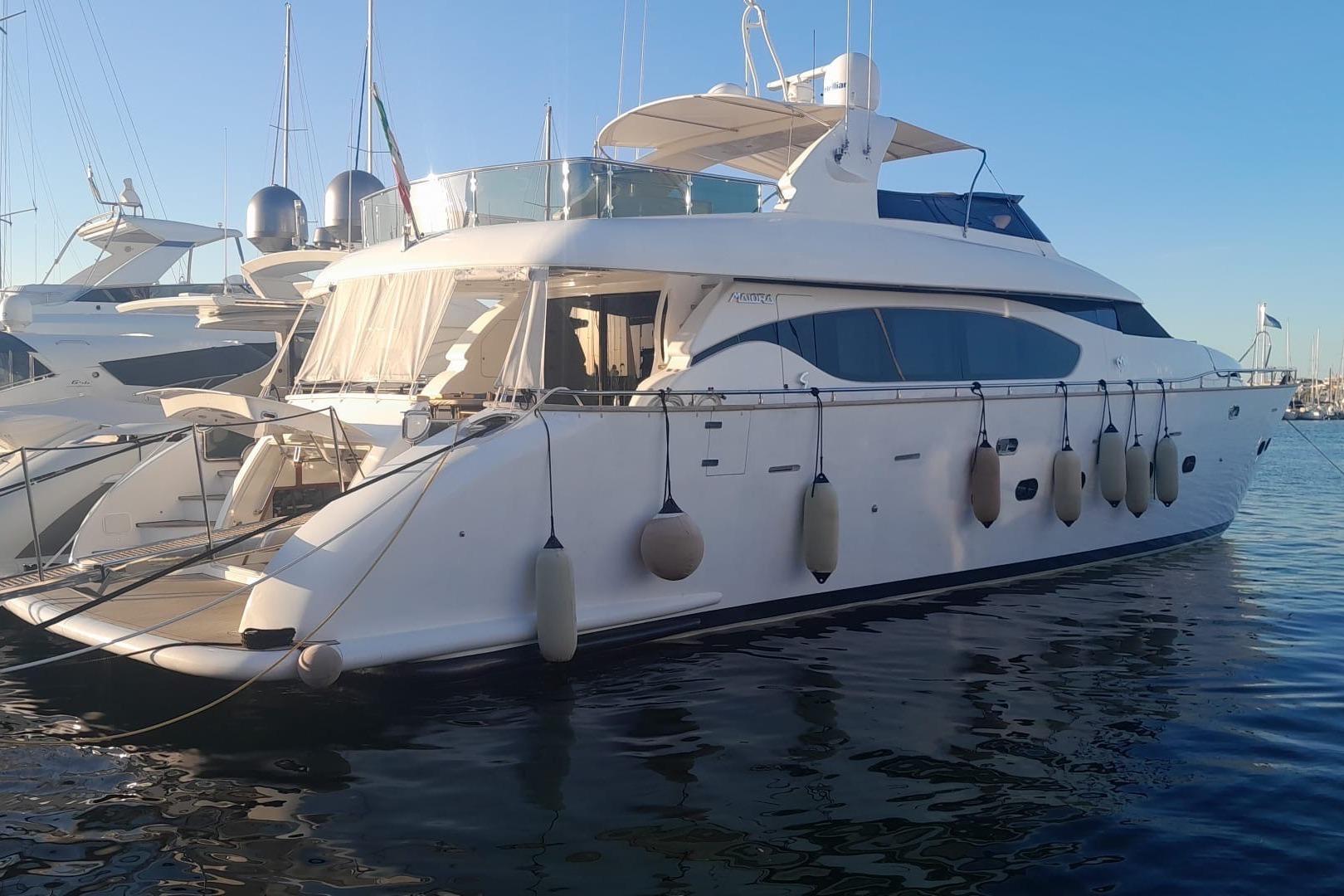 Maiora 24 S Luxurious 2004 Maiora 24 S yacht docked in a serene marina setting.