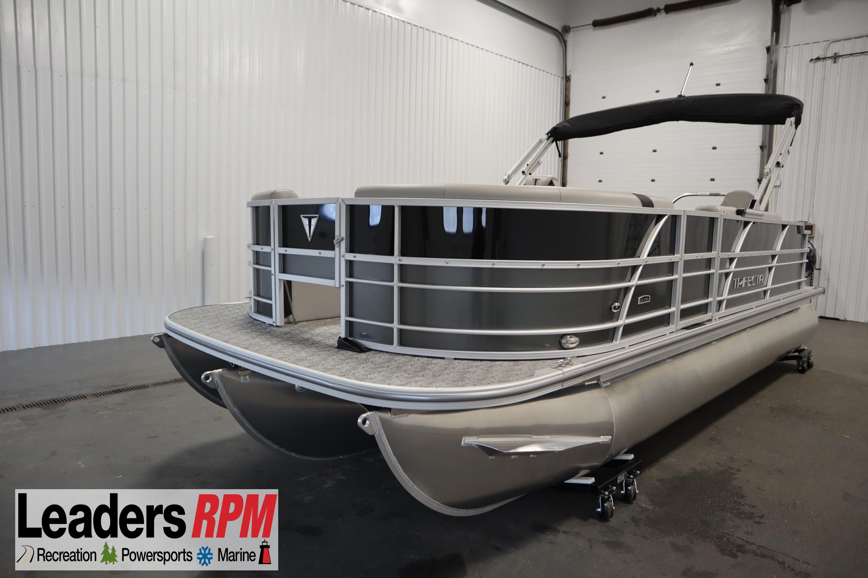 Trifecta 22TRFC LE 2.75 2025 Trifecta 22TRFC LE 2.75 pontoon boat in showroom, Leaders RPM logo visible.