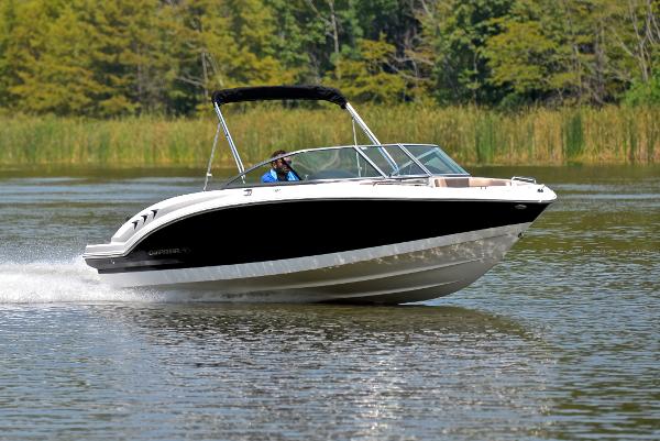 Chaparral 23 H20 2019 Chaparral 23 H20 boat cruising on a lake with lush greenery.