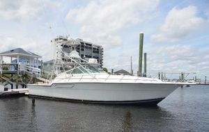 Tiara Yachts 43 Open 1992 Tiara Yachts 43 Open docked at marina under cloudy sky.