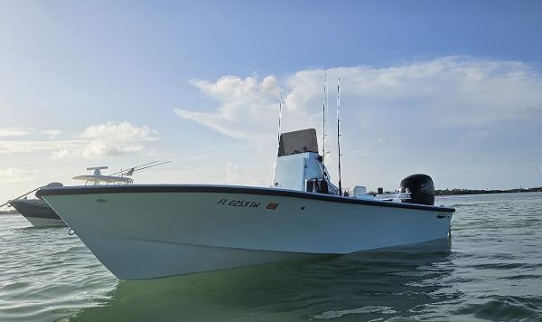 Cuda Craft 19 2025 Cuda Craft 19 boat on calm water under a clear sky.