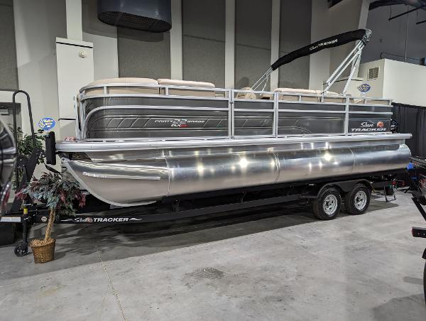 Sun Tracker Party Barge 22 RF XP3 2024 Sun Tracker Party Barge 22 RF XP3 pontoon boat on display indoors.