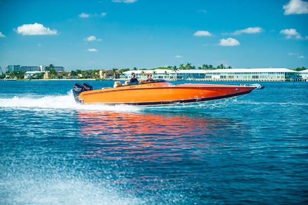 Velocity 430VRX 2024 Velocity 430VRX speedboat cruising on clear blue water.