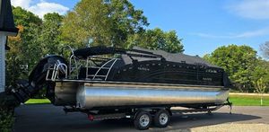 Harris FloteBote Solstice 230 2020 Harris FloteBote Solstice 230 pontoon boat on trailer, covered, parked outdoors.