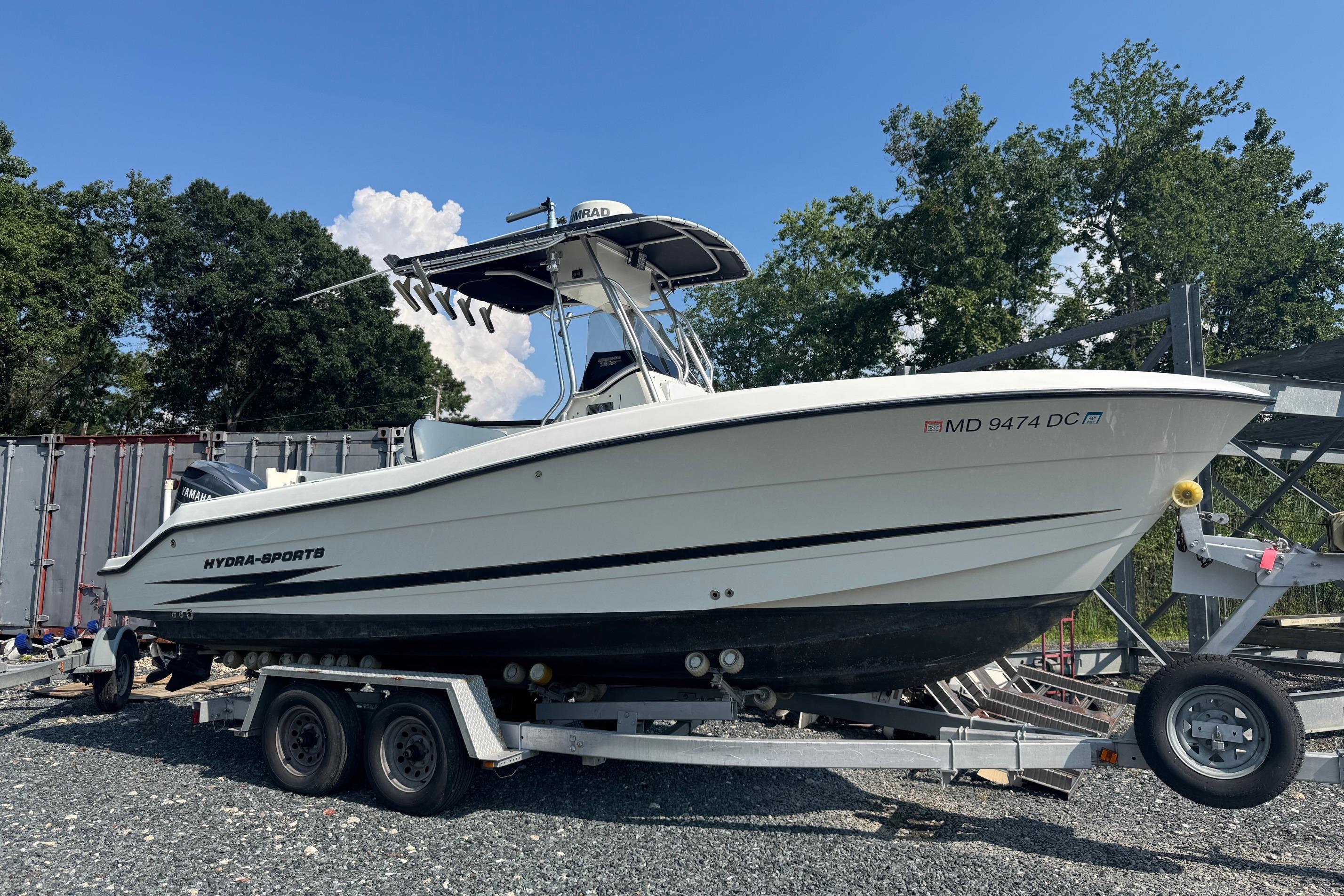 Hydra-Sports Vector 2400 CC 2003 Hydra-Sports Vector 2400 CC boat on trailer, parked outdoors.