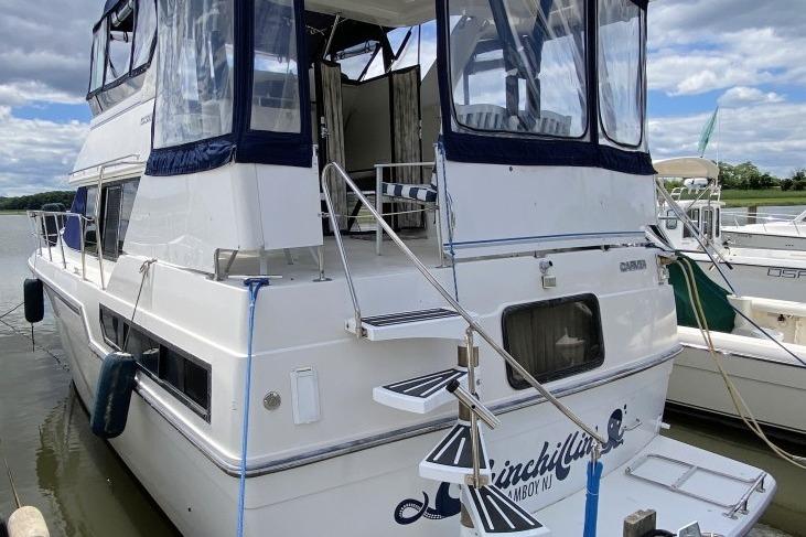 Carver 36 Aft Cabin Motor Yacht 1992 Carver 36 Aft Cabin yacht docked, featuring spacious deck and elegant design.
