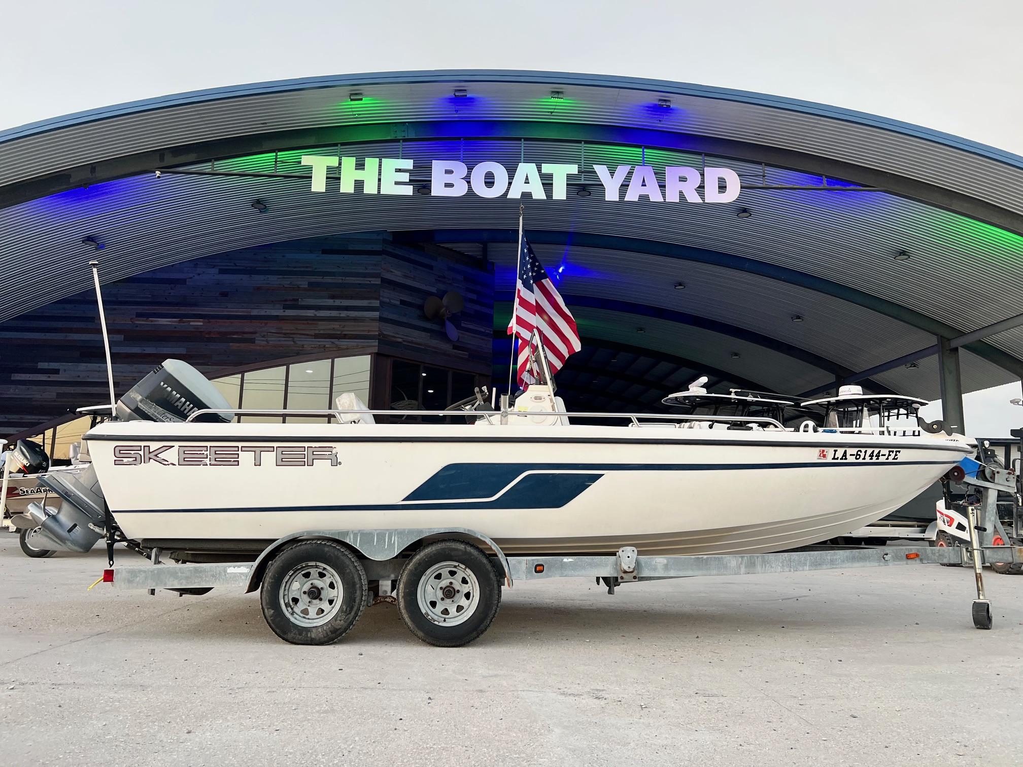 Skeeter ZX 2200 2001 Skeeter ZX 2200 boat on trailer at The Boat Yard, American flag displayed.