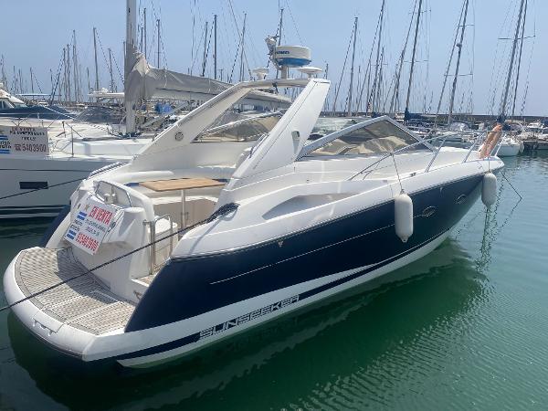 Sunseeker Portofino 35 2003 Sunseeker Portofino 35 yacht docked in marina, sleek design, blue and white exterior.