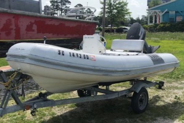 Novurania Tender 1995 Novurania Tender boat on trailer, parked outdoors.