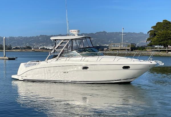 Sea Ray 290 Amberjack 2005 Sea Ray Amberjack 290 boat on calm water, clear sky background.