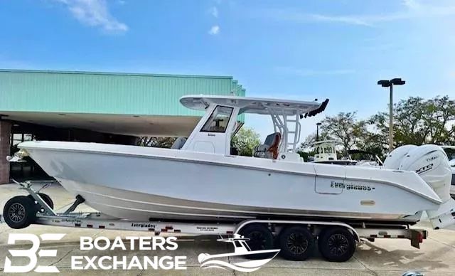 Everglades 335 CC 2024 Everglades 335 CC boat on trailer at Boaters Exchange dealership.