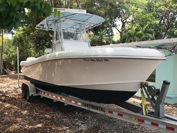 Ocean Master 29 CC 2014 Ocean Master 29 CC boat on trailer, surrounded by trees.