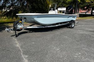 Mako Pro Skiff 17 CC 2026 Mako Pro Skiff 17 CC boat on trailer in parking lot.
