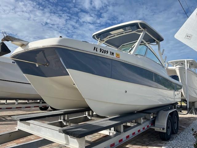 World Cat 230 DC 2023 World Cat 230 DC boat on trailer under blue sky.