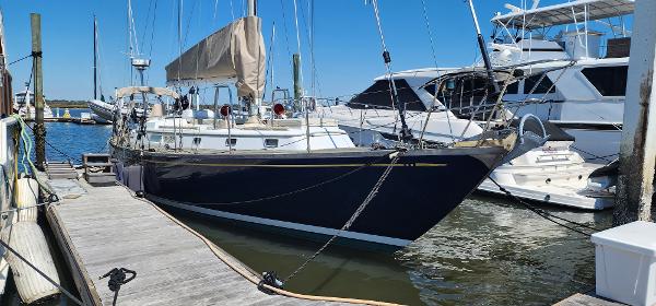 Mason 44 Sailboat docked at marina, Mason 44 model, 1988, with clear blue sky.