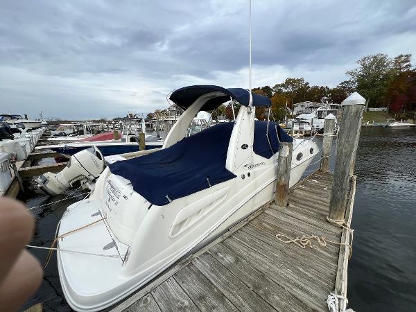 Sea Ray 260 Sundancer 2006 Sea Ray 260 Sundancer docked at marina with blue cover.