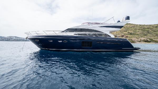 Princess 64 Luxury 2012 Princess 64 yacht on calm blue waters, side view.