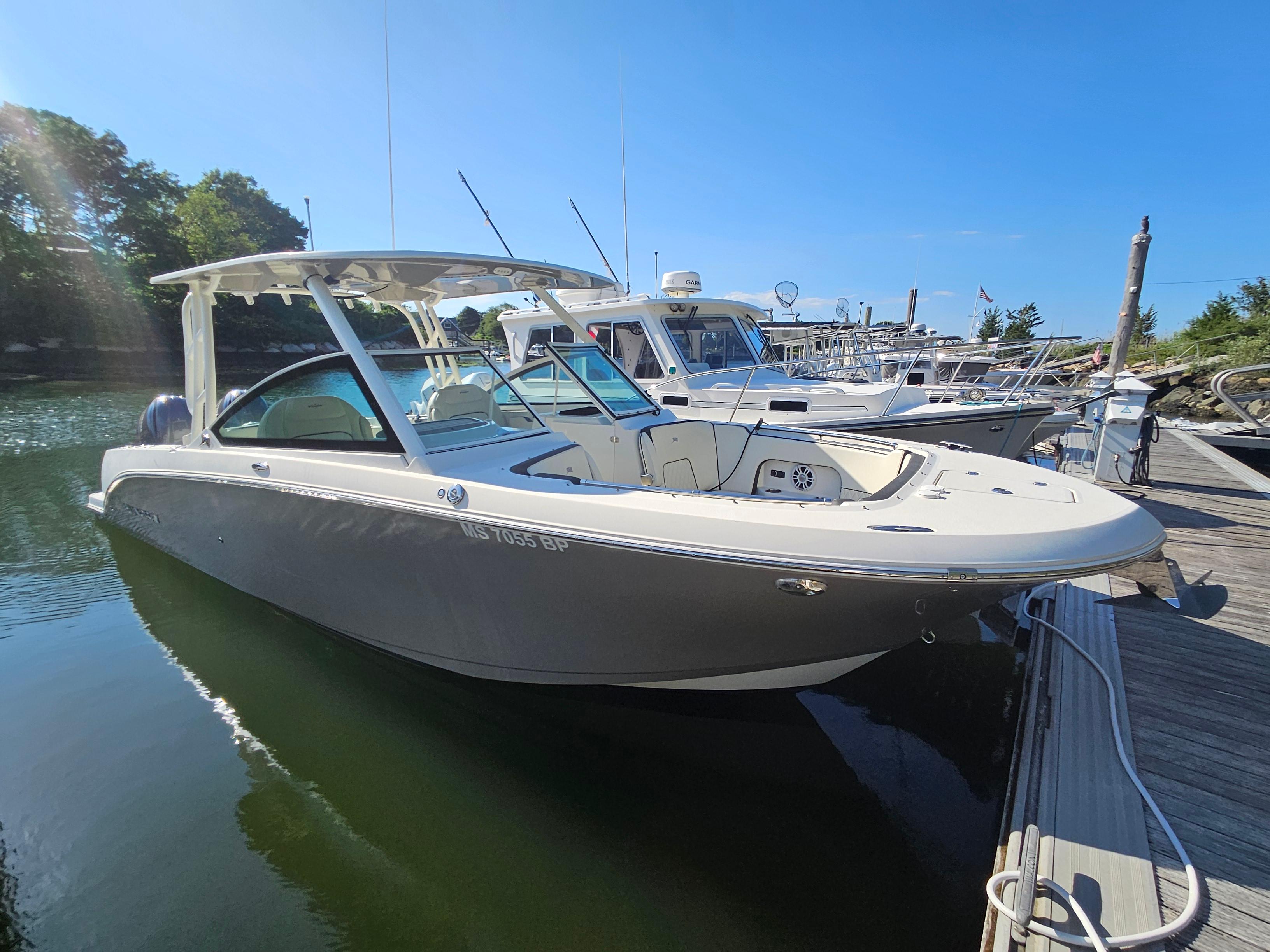 Stingray 269 DC 2020 Stingray 269 DC boat docked in a marina under clear blue sky.
