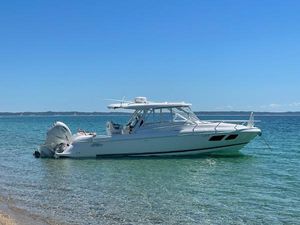 Intrepid 345 Valor Intrepid 345 Valor 2021 boat anchored in clear blue water on a sunny day.