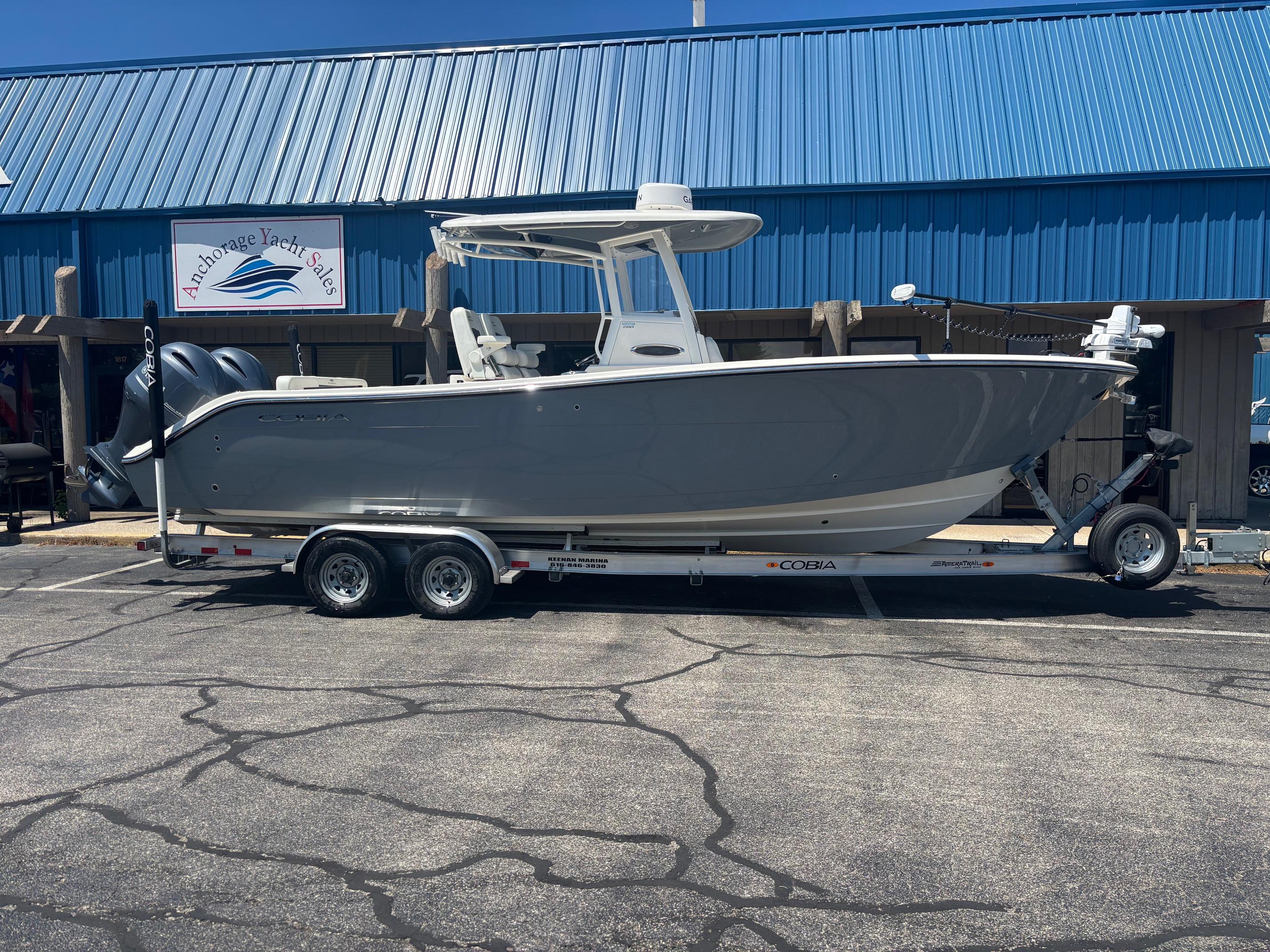 Cobia 280 Center Console 2023 Cobia 280 Center Console boat on trailer at Anchorage Yacht Sales.
