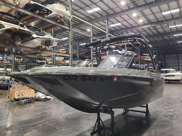 ATX Surf Boats Tige 20 2022 ATX Surf Boats Tige 20 in a warehouse.