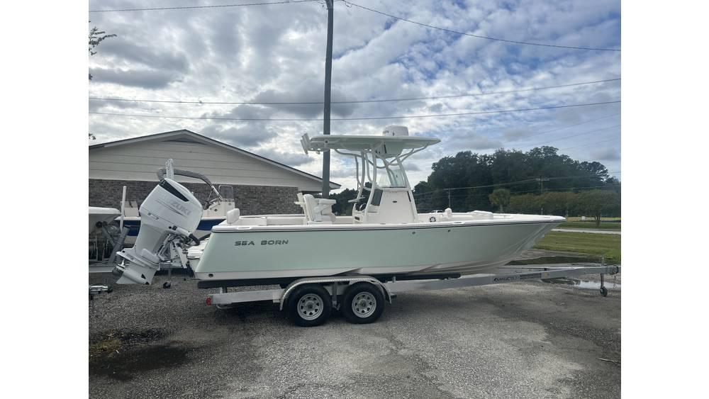 Sea Born LX22 Center Console 2024 Sea Born LX22 Center Console boat on trailer, parked outdoors under cloudy sky.