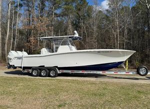 Invincible 36 Open Fisherman 2019 Invincible 36 Open Fisherman boat on trailer in wooded area.