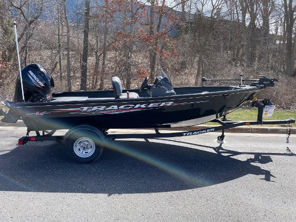 Tracker Super Guide V-16 SC 2025 Tracker Super Guide V-16 SC boat on trailer, parked outdoors.