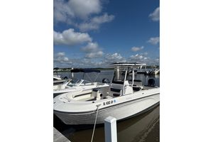 Trophy CC24 2023 Trophy CC24 boat docked under a clear blue sky.