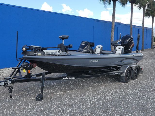 Falcon Bass Boats F20 PREDATOR 2021 Falcon Bass Boats F20 PREDATOR on trailer, parked near blue wall, palm trees in background.