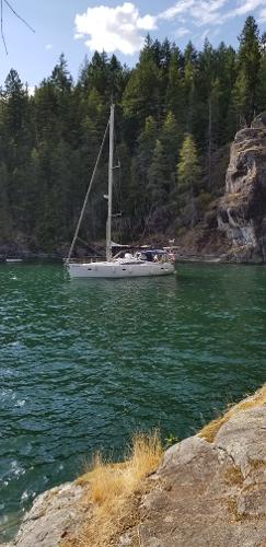 Elan Impression 434 Sailboat Elan Impression 434 (2007) anchored in a scenic, forested cove.