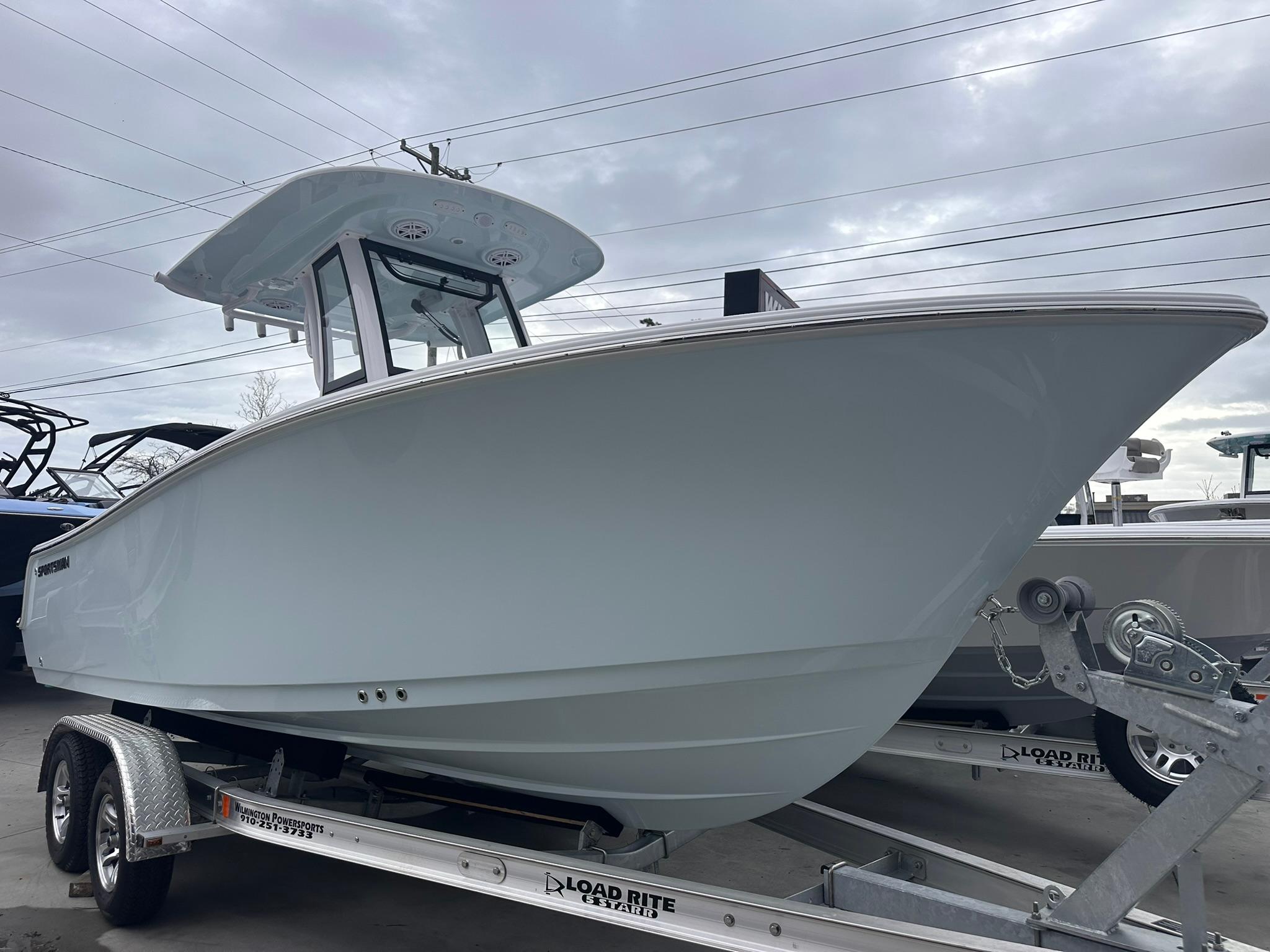 Sportsman Open 212 Center Console 2025 Sportsman Open 212 Center Console boat on trailer, under cloudy sky.