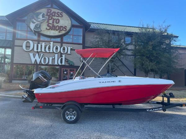 Tahoe T18 2025 Tahoe T18 boat with red canopy outside Bass Pro Shops Outdoor World.