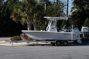 Sea Pro 202 Center Console 2026 Sea Pro 202 Center Console boat on trailer, parked near palm trees.