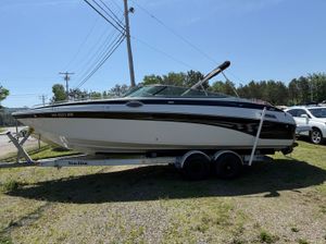 Crownline 270 BR 2007 Crownline 270 BR boat on trailer, parked outdoors under clear sky.